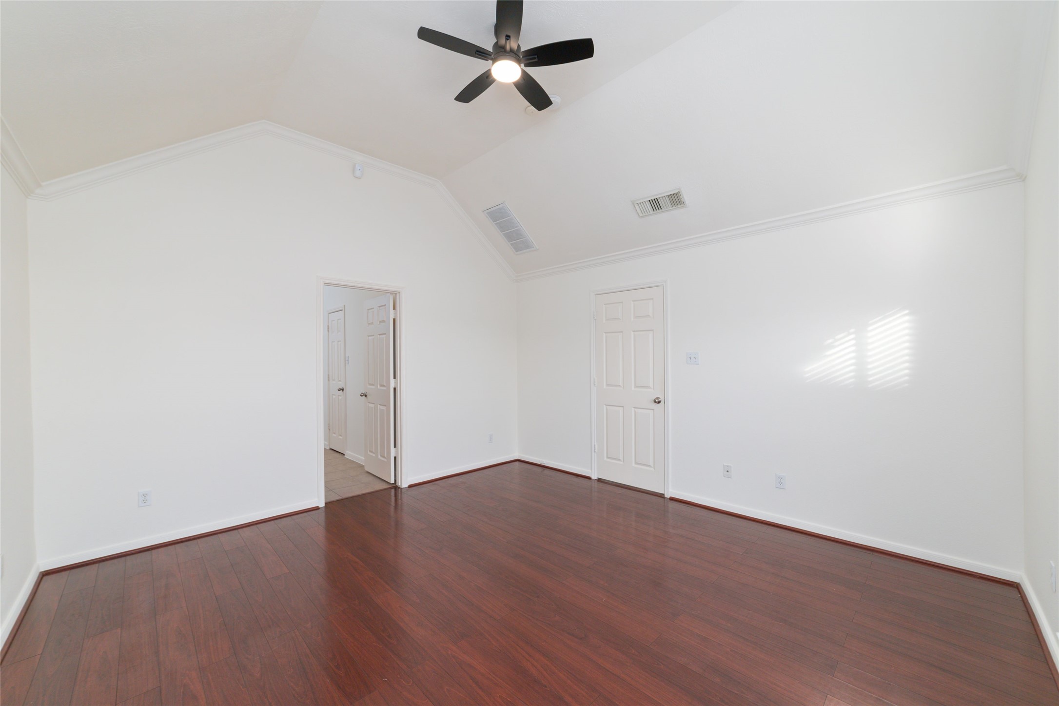 12519 East Nantucket Road Sugar Land, TX 77478 - Photo 14 of 25 an empty room with wooden floor and windows