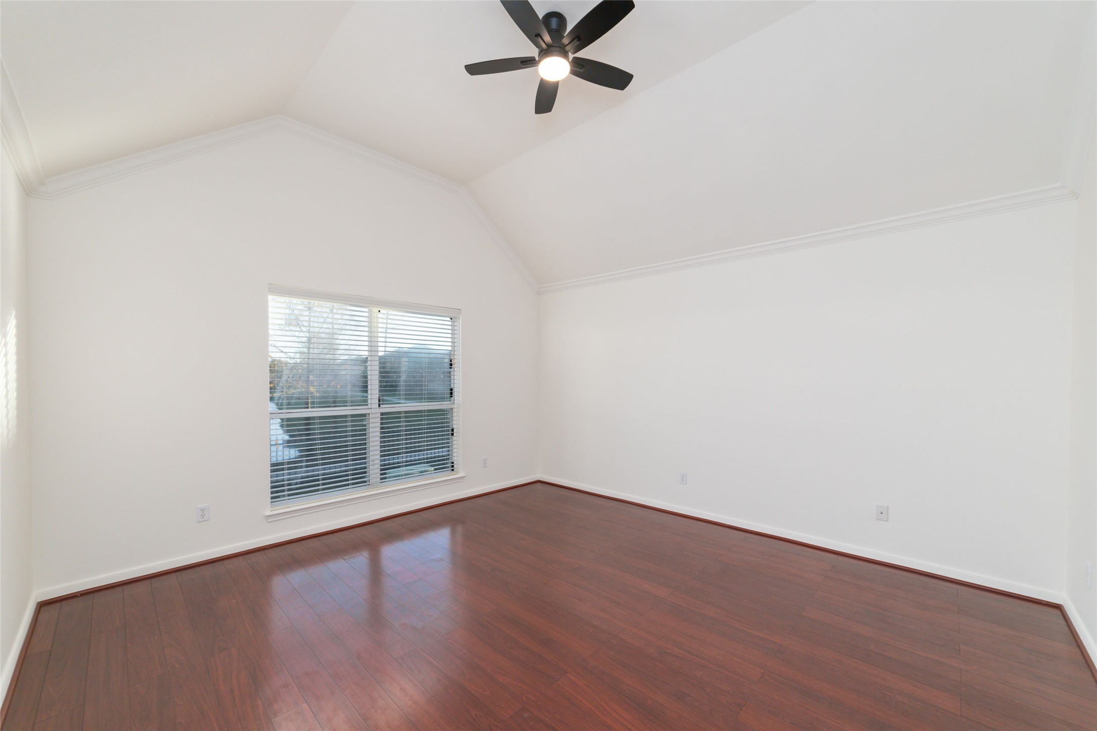 12519 East Nantucket Road Sugar Land, TX 77478 - Photo 15 of 25 an empty room with wooden floor fan and windows