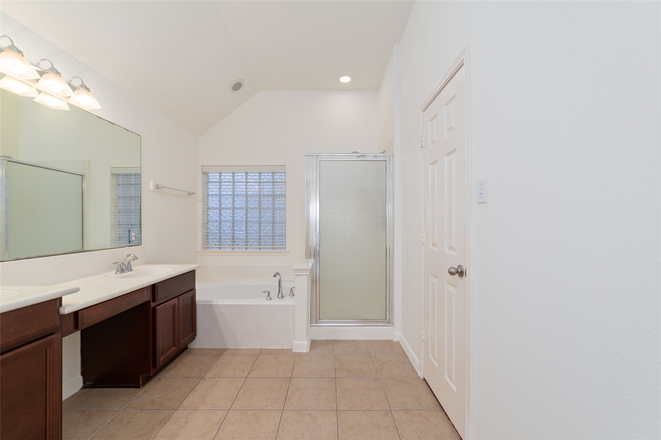 12519 East Nantucket Road Sugar Land, TX 77478 - Photo 16 of 25 a spacious bathroom with a bathtub sink and mirror