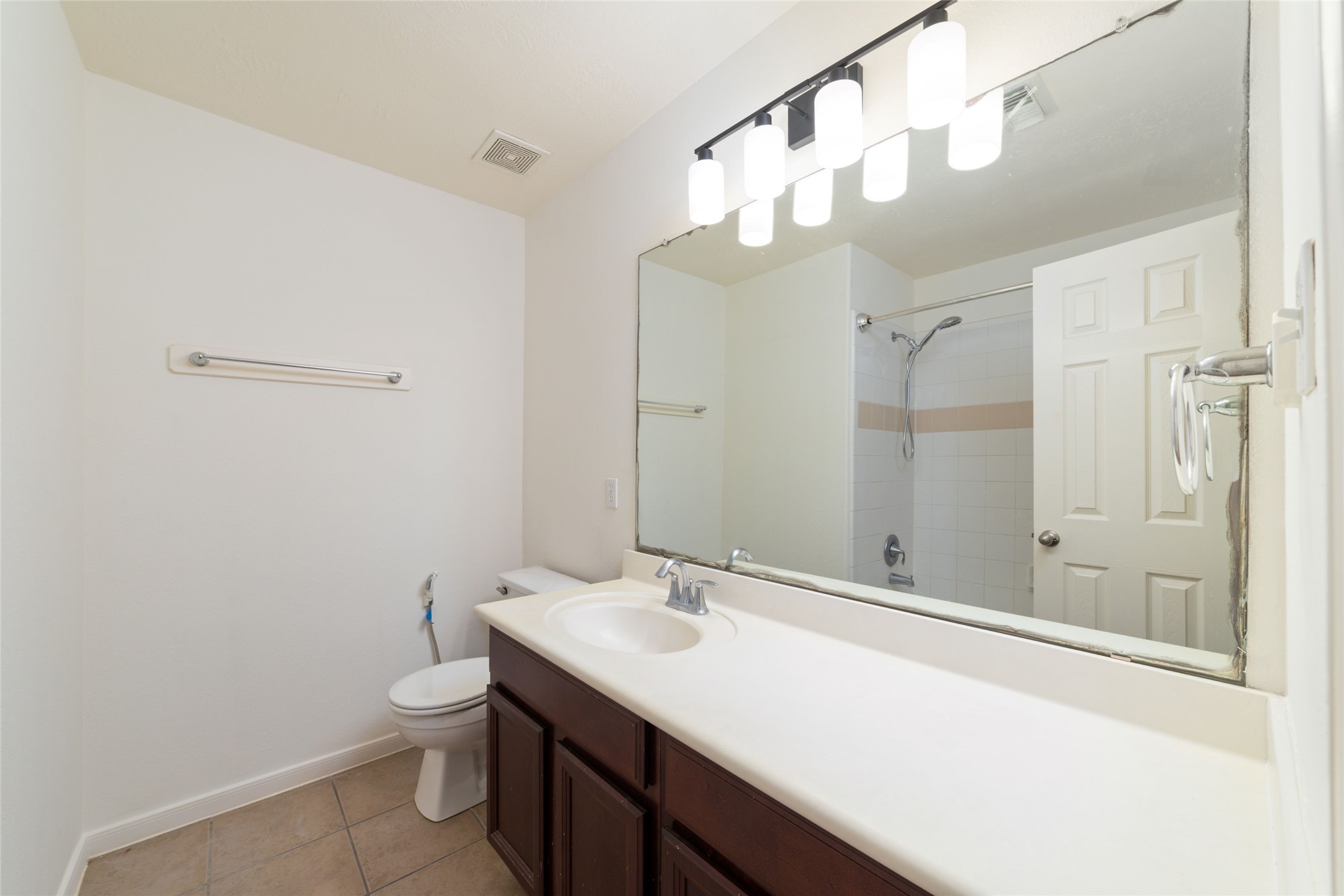 12519 East Nantucket Road Sugar Land, TX 77478 - Photo 19 of 25 a bathroom with a sink a toilet and shower