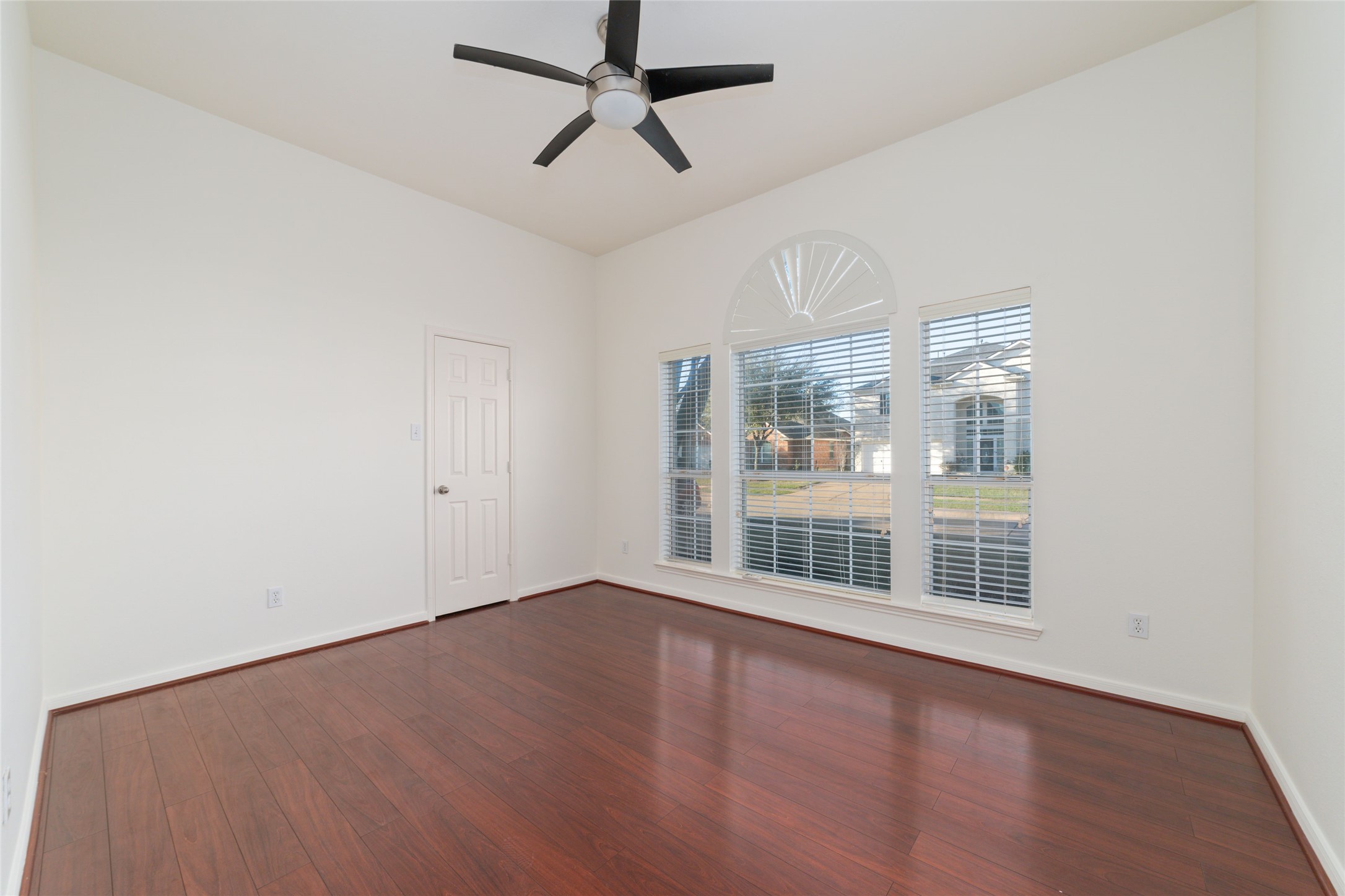 12519 East Nantucket Road Sugar Land, TX 77478 - Photo 20 of 25 a view of an empty room with wooden floor and a window