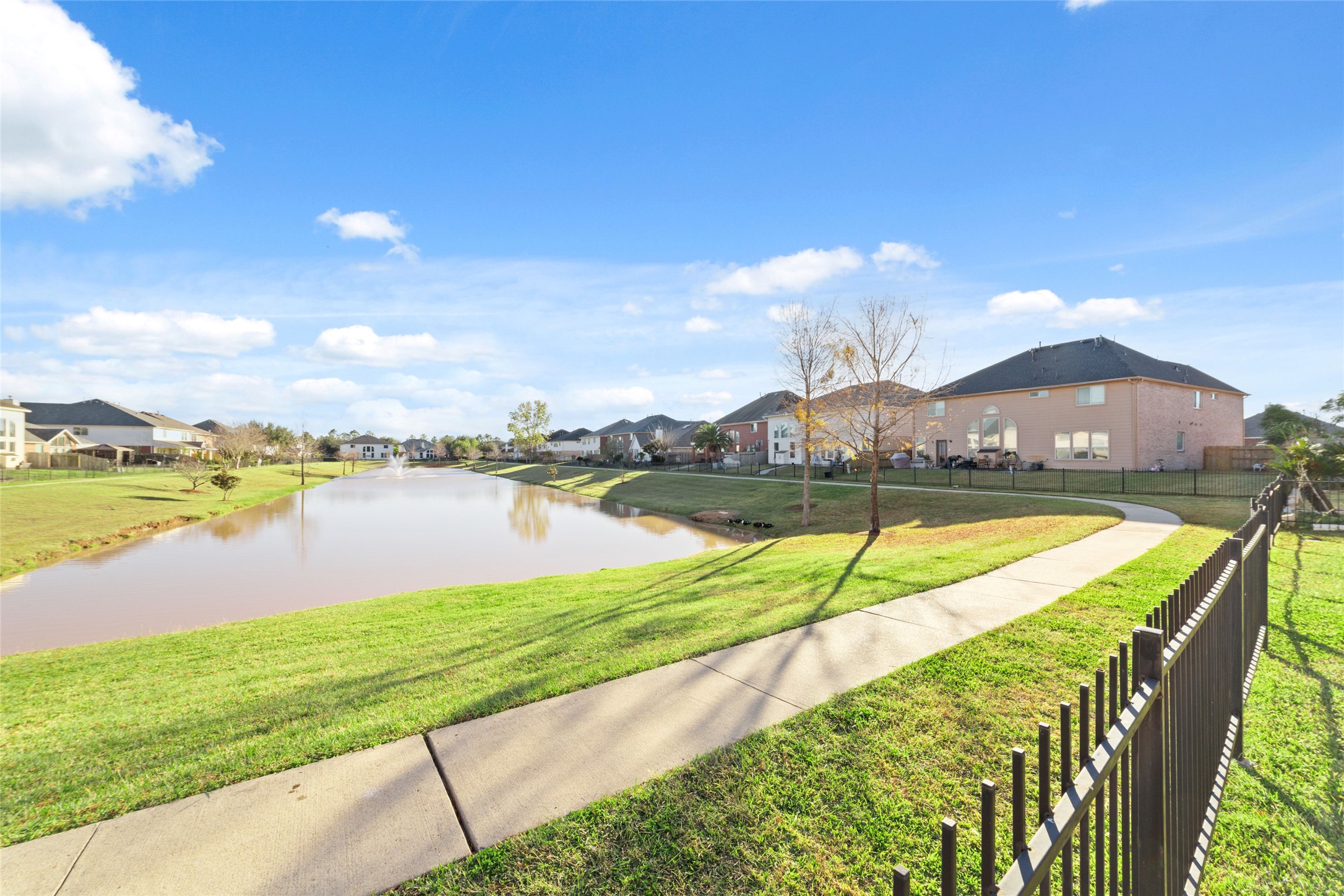 12519 East Nantucket Road Sugar Land, TX 77478 - Photo 25 of 25 a view of a lake with a big yard