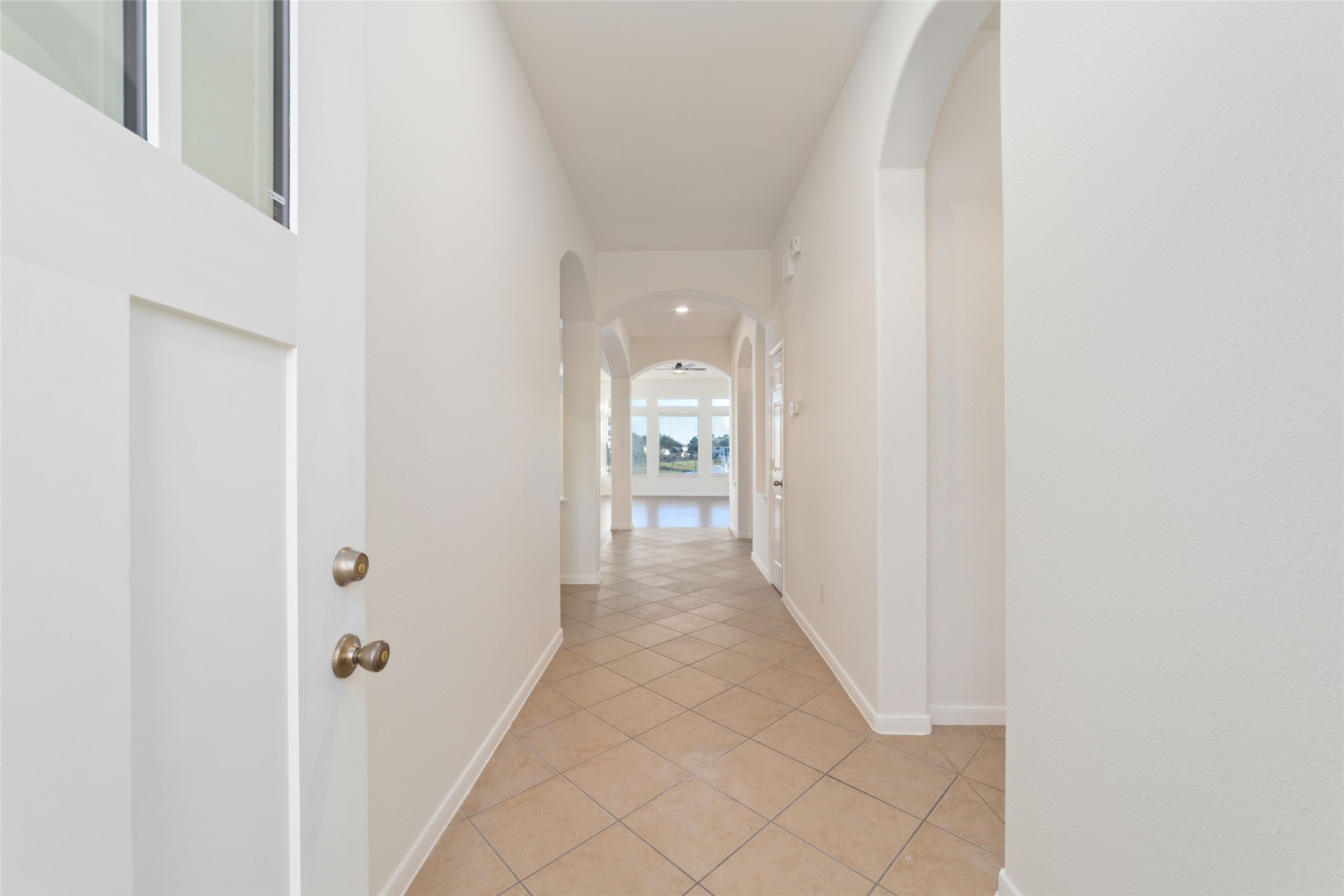 12519 East Nantucket Road Sugar Land, TX 77478 - Photo 4 of 25 a view of a hallway with wooden shelves