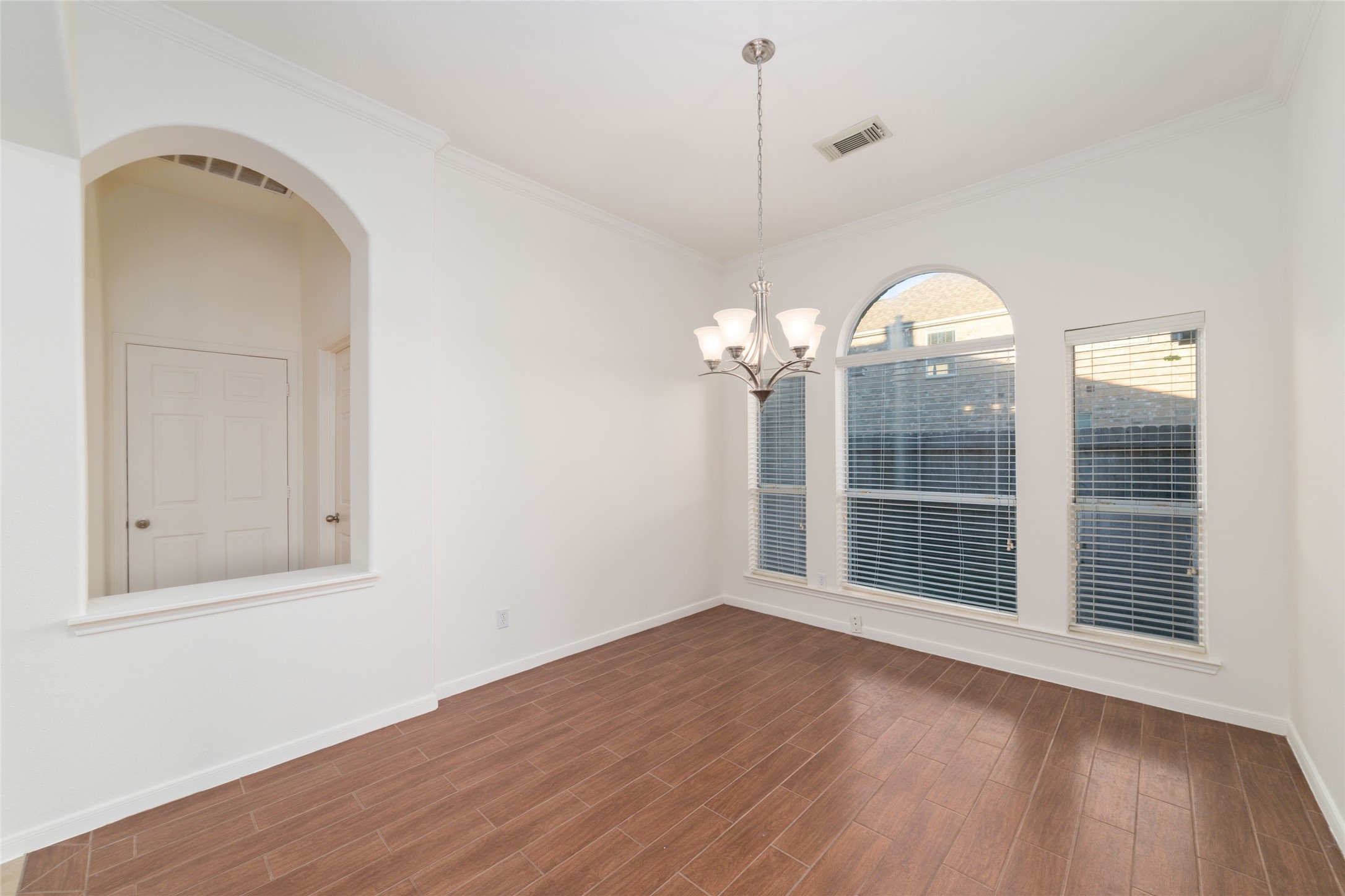 12519 East Nantucket Road Sugar Land, TX 77478 - Photo 8 of 25 a view of a livingroom with wooden floor and a large window