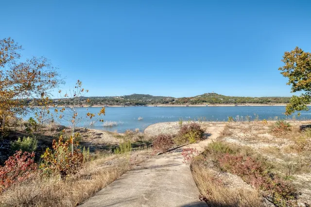 a view of lake with green space