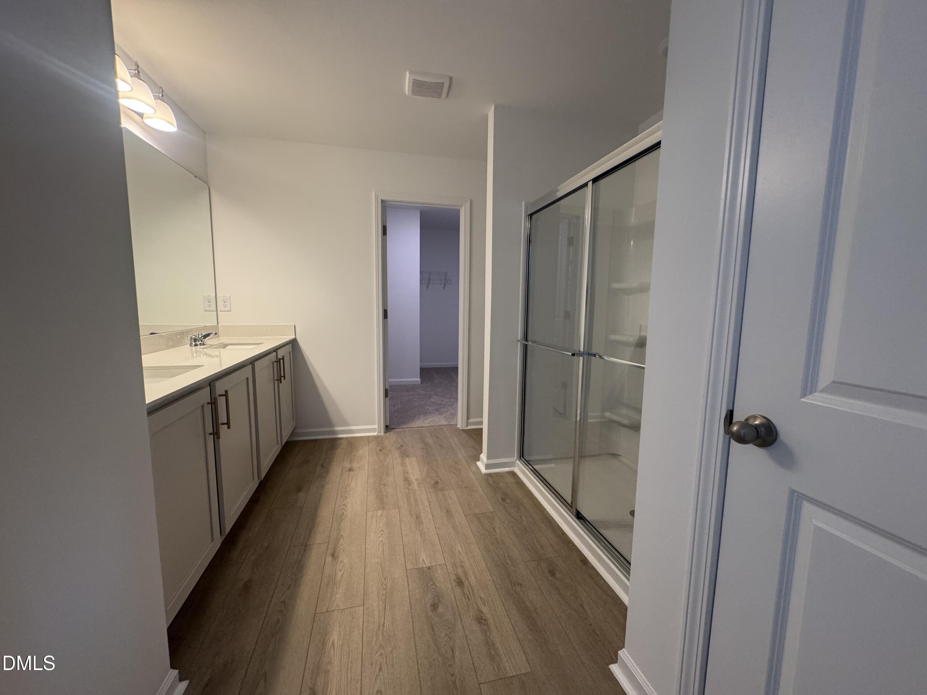 11742 Salers Loop Middlesex, NC 27557 - Photo 17 of 20 a bathroom with a sink and shower
