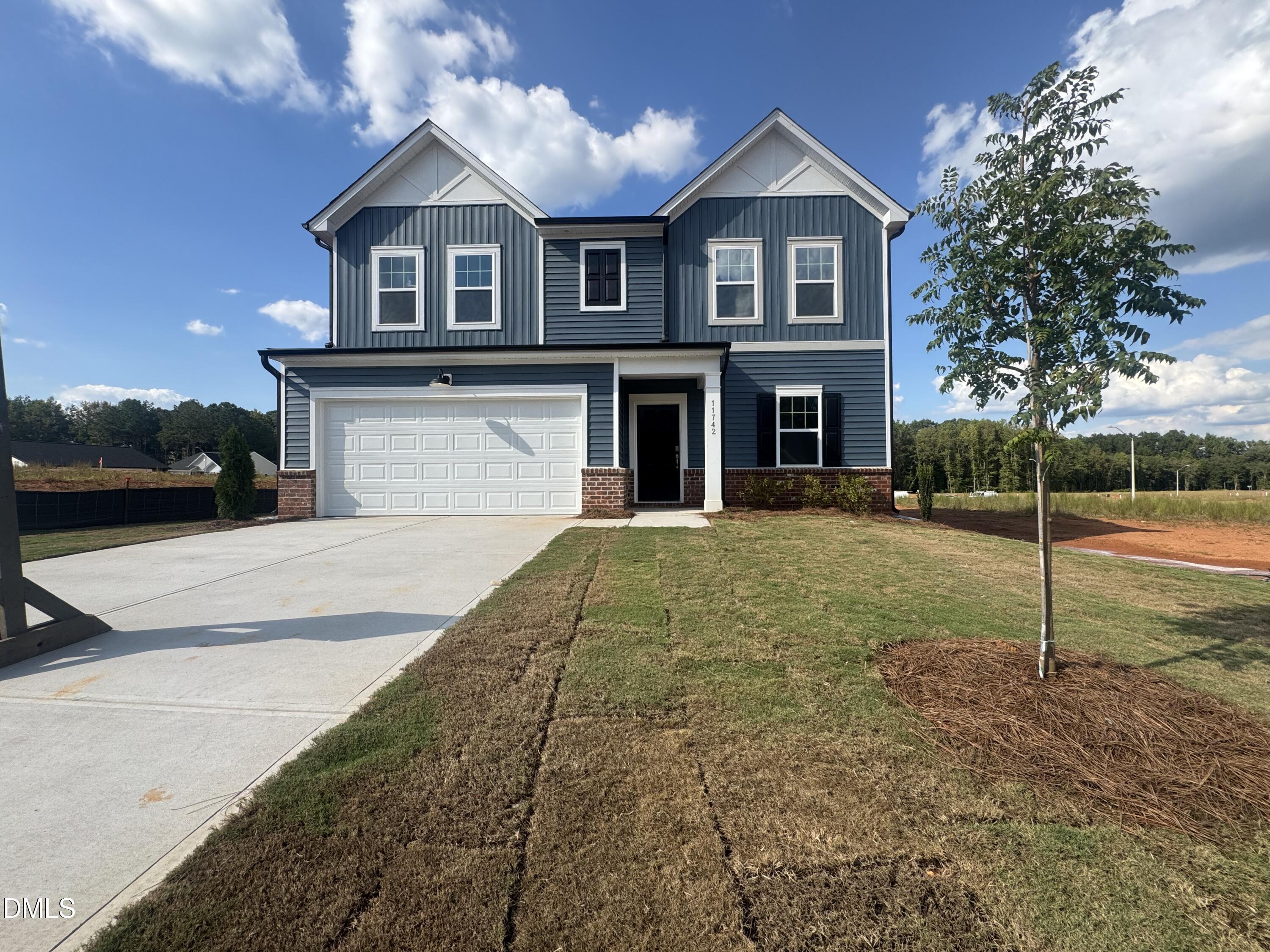 11742 Salers Loop Middlesex, NC 27557 - Photo 18 of 20 a front view of a house with garden
