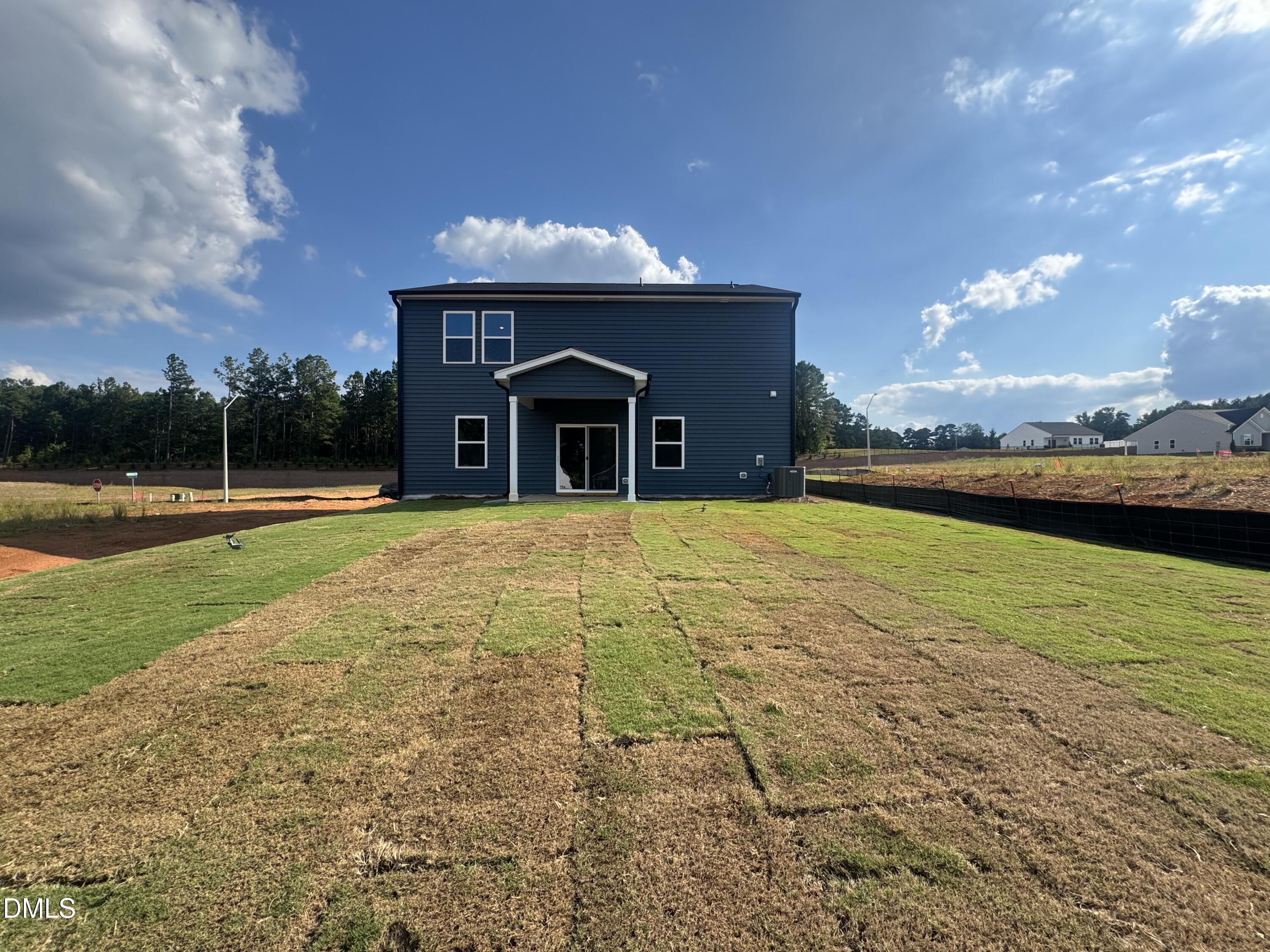 11742 Salers Loop Middlesex, NC 27557 - Photo 20 of 20 a view of a house with a swimming pool and a yard