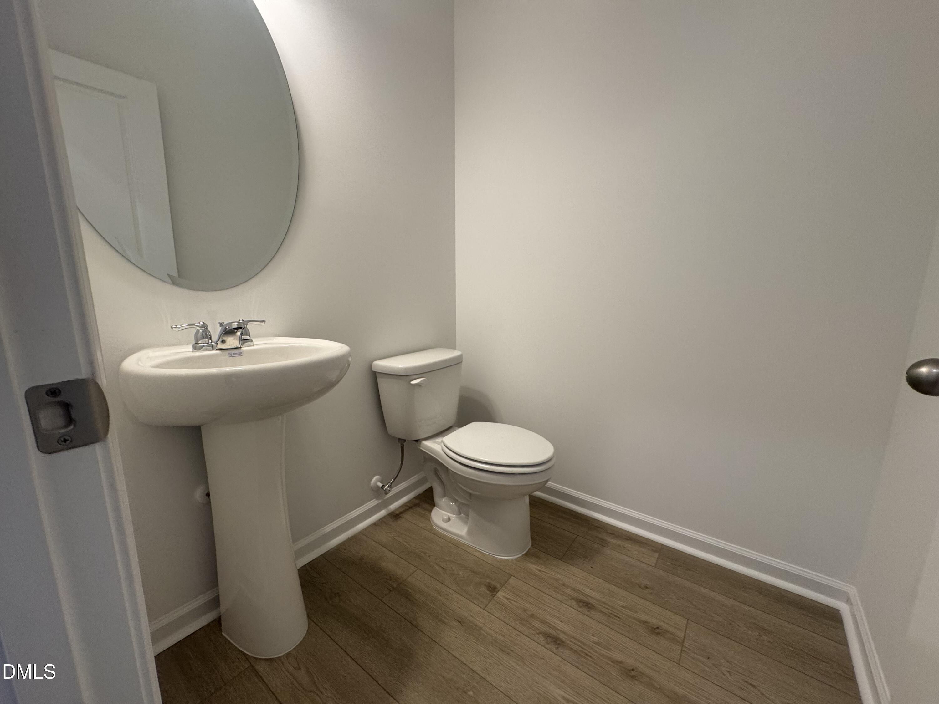 11742 Salers Loop Middlesex, NC 27557 - Photo 9 of 20 a bathroom with a sink toilet and a mirror