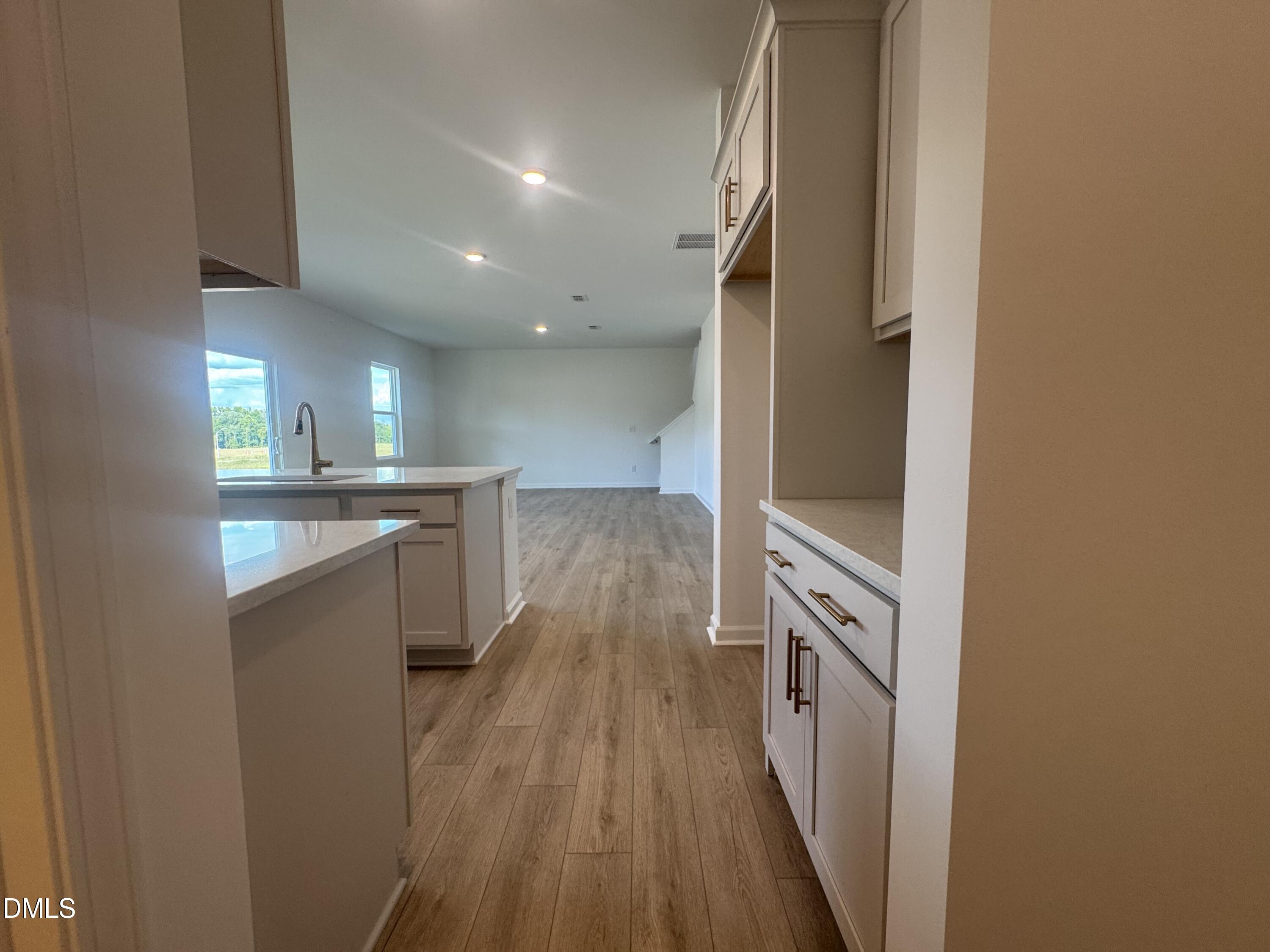 11742 Salers Loop Middlesex, NC 27557 - Photo 10 of 20 a view of a kitchen cabinets and wooden floor