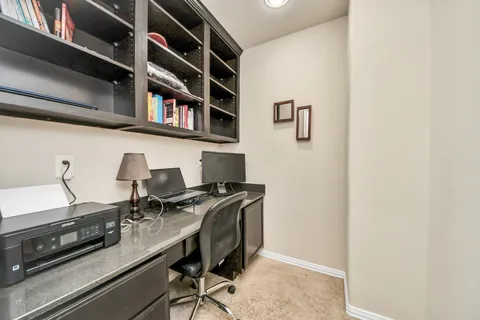 a view of a workspace with furniture