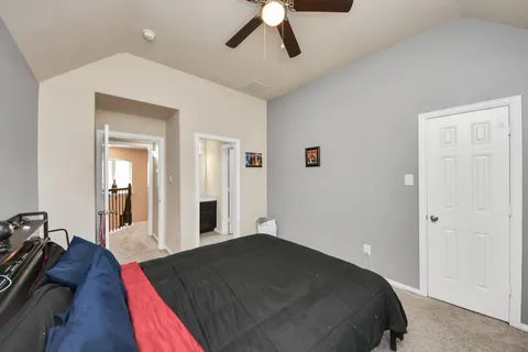 a bed room with a bed and a chandelier