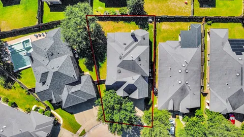 an aerial view of house with swimming pool and outdoor space