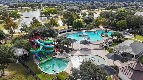 an aerial view of a house with outdoor space