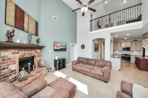 a living room with furniture and a fireplace