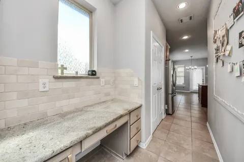 a bathroom with a granite countertop sink