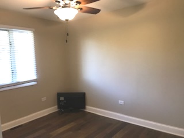 19506 West Manhattan Road Elwood, IL 60421 - Photo 21 of 32 an empty room with a window and a fan
