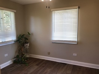 19506 West Manhattan Road Elwood, IL 60421 - Photo 23 of 32 a room with a window and wooden floor