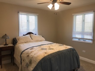 19506 West Manhattan Road Elwood, IL 60421 - Photo 24 of 32 a bedroom with a bed and window