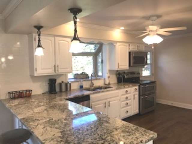 19506 West Manhattan Road Elwood, IL 60421 - Photo 6 of 32 a large kitchen with cabinets