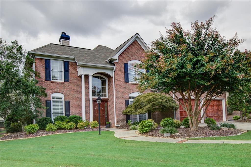front view of a house with a yard