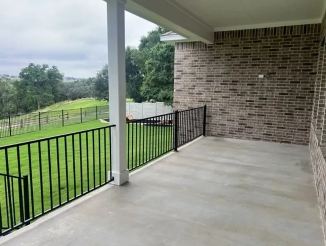 a view of a balcony with wooden floor