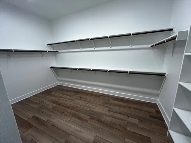 a room with a sink and a mirror