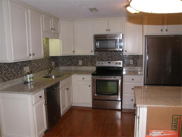 356 Neponset Street, Unit E Canton, MA 02021 - Photo 3 of 8 a kitchen with stainless steel appliances granite countertop a stove a sink and a refrigerator