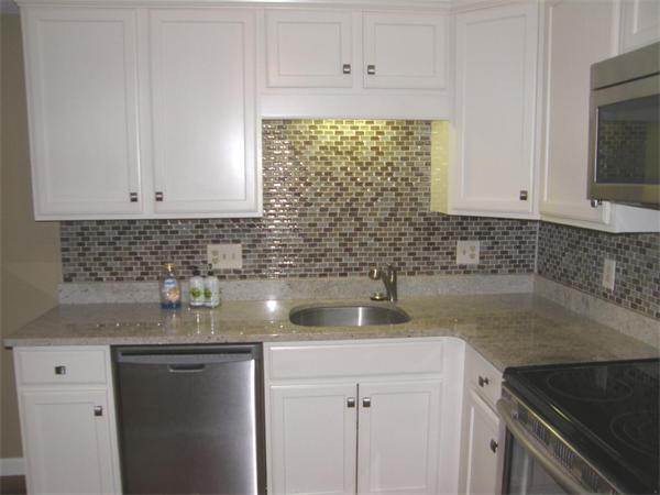 356 Neponset Street, Unit E Canton, MA 02021 - Photo 4 of 8 a kitchen with stainless steel appliances granite countertop white cabinets and a sink