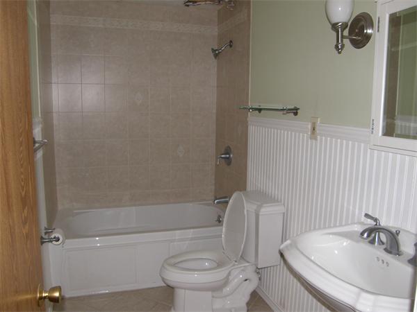 356 Neponset Street, Unit E Canton, MA 02021 - Photo 8 of 8 a bathroom with a sink toilet and shower