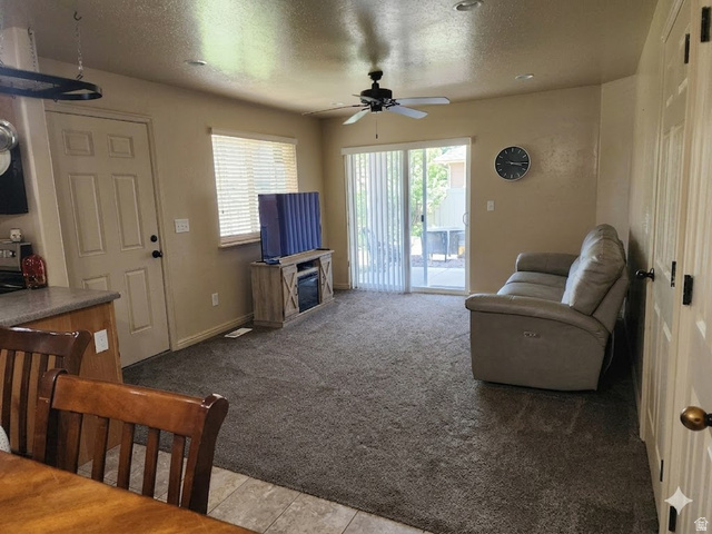 2525 West 450 South, Unit 8 Springville, UT 84663 - Photo 3 of 22 Open-concept living space with textured carpeting, recessed lighting, and a ceiling fan