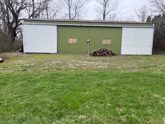 201 Summit Street Lebanon, OH 45036 - Photo 45 of 45 This expansive green structure with white sliding doors offers versatile storage and utility.