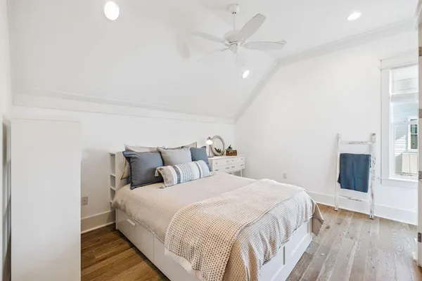 a bedroom with a bed and a couch