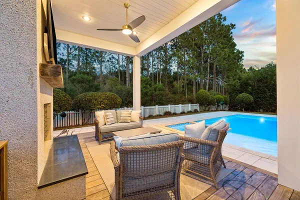 a outdoor space with patio the couches and pool table with garden view