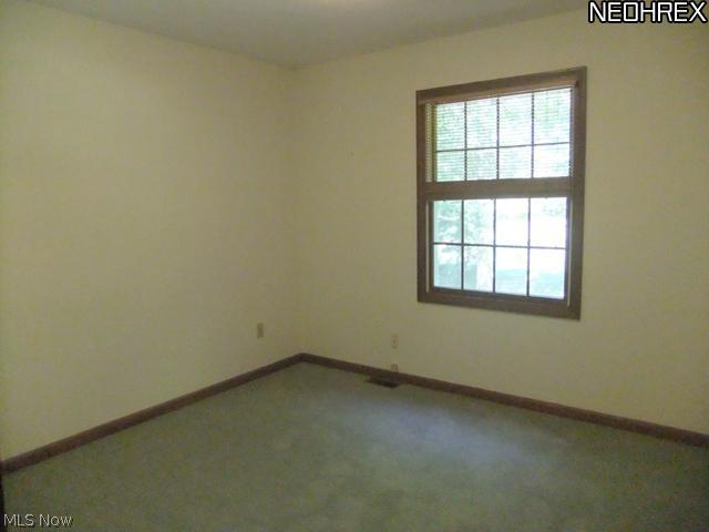 4601 Pinewood Path Akron, OH 44321 - Photo 20 of 23 Bedroom 4 features neutral carpet and a double closet!