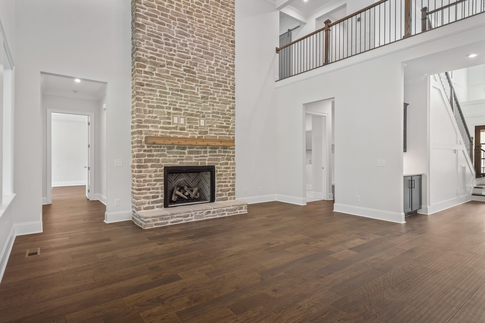 7244 Murrel Drive Franklin, TN 37064 - Photo 18 of 57 a view of an empty room with wooden floor fireplace and a window