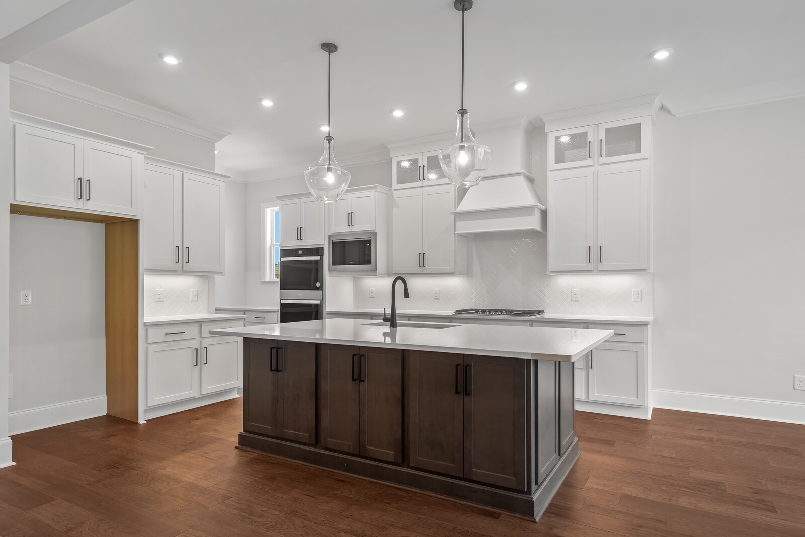 7244 Murrel Drive Franklin, TN 37064 - Photo 20 of 57 a kitchen with kitchen island a sink stainless steel appliances and cabinets