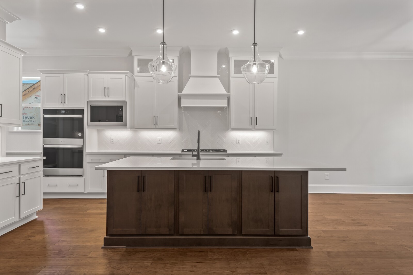 7244 Murrel Drive Franklin, TN 37064 - Photo 21 of 57 a kitchen with kitchen island granite countertop a sink refrigerator and cabinets