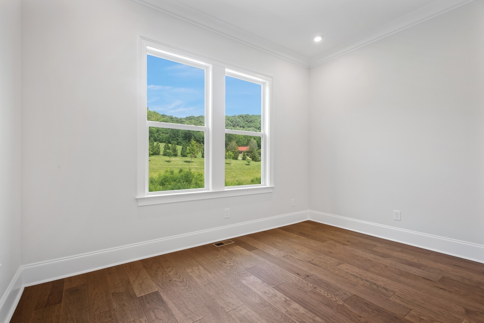 7244 Murrel Drive Franklin, TN 37064 - Photo 48 of 57 an empty room with wooden floor and windows