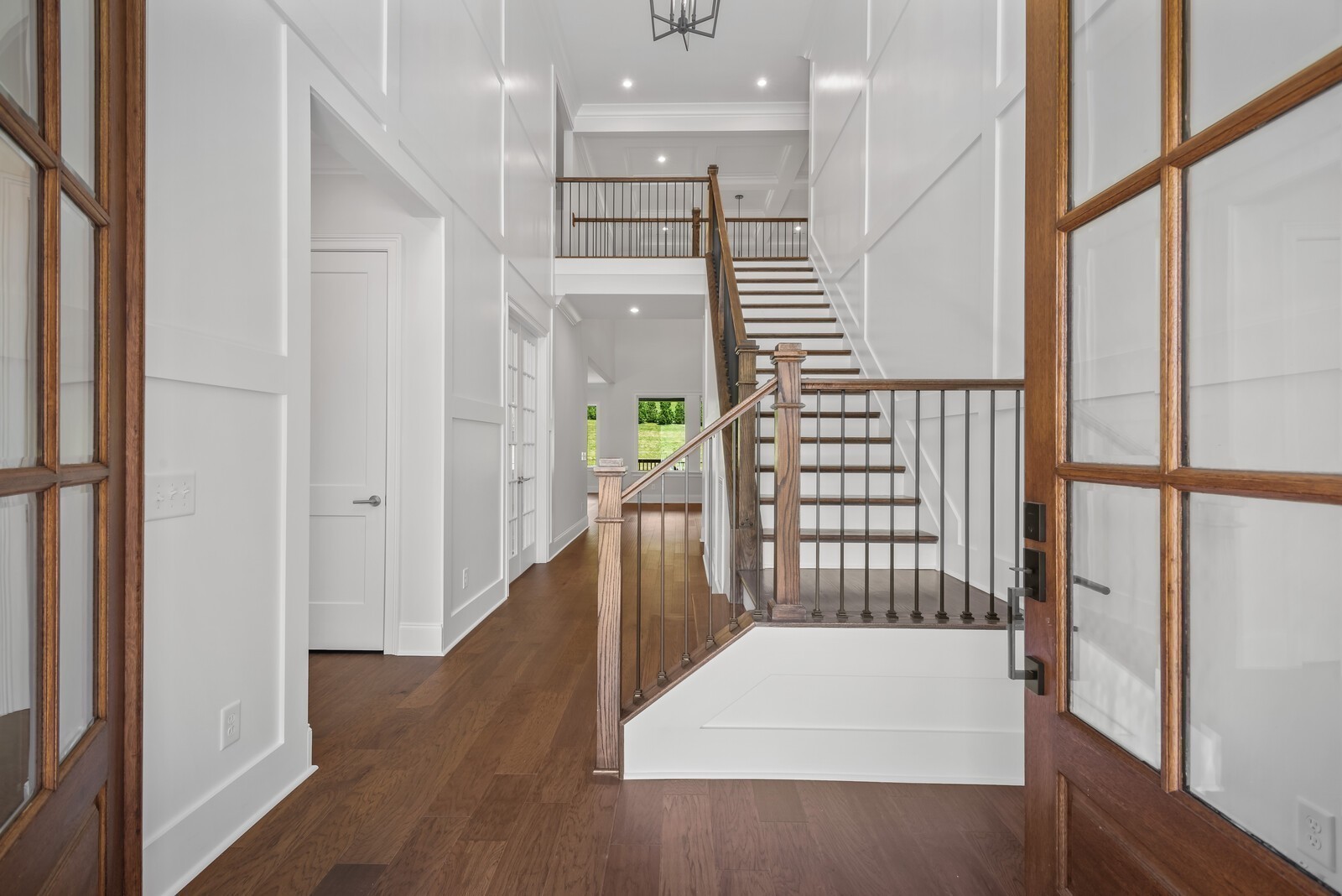 7244 Murrel Drive Franklin, TN 37064 - Photo 6 of 57 a view of hallway with wooden floor and stairs