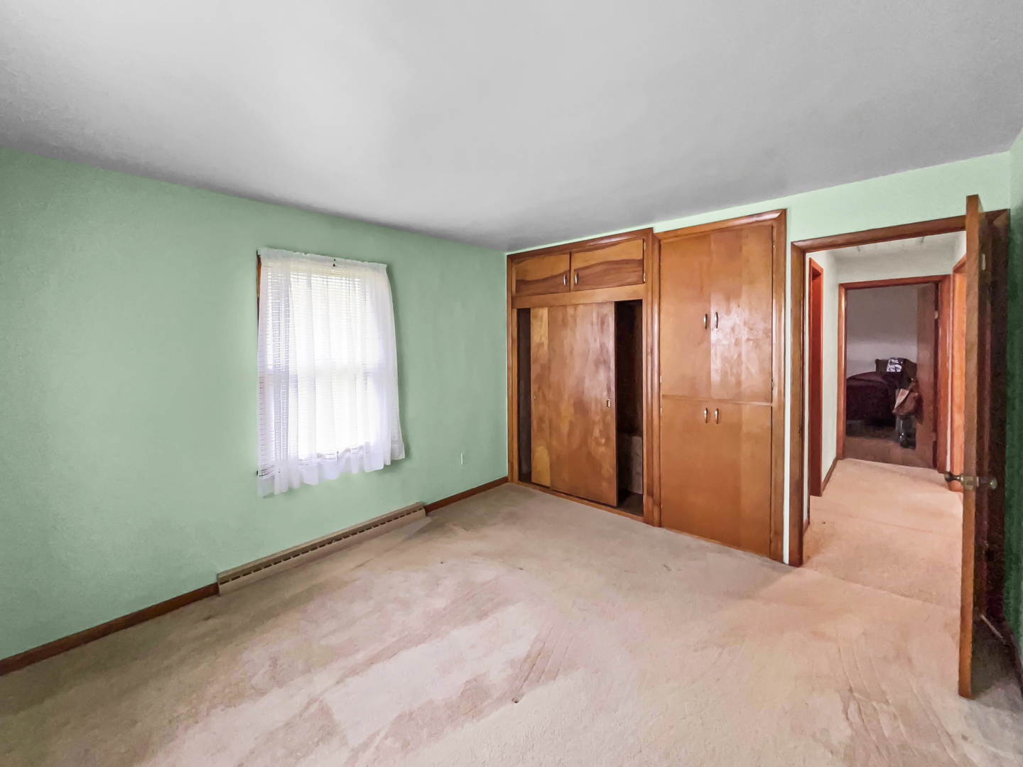 610 West Seminary Avenue Onarga, IL 60955 - Photo 6 of 10 an empty room with windows and closet