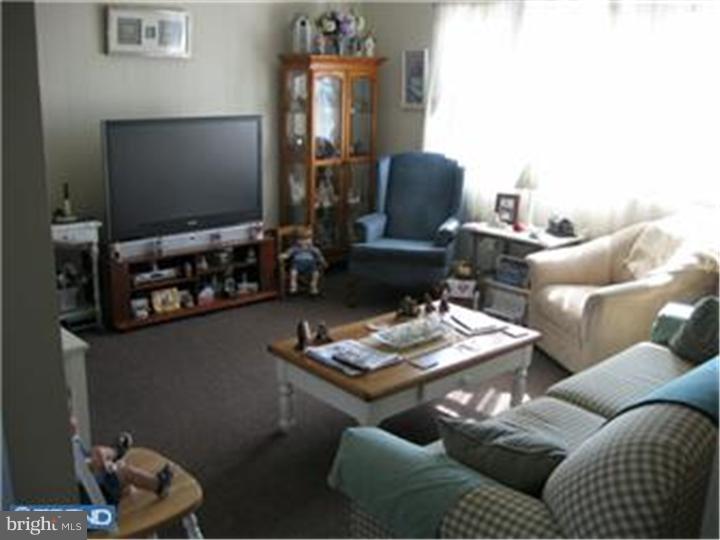 605-607 Filmore Street Riverside, NJ 08075 - Photo 3 of 7 a living room with furniture and a flat screen tv