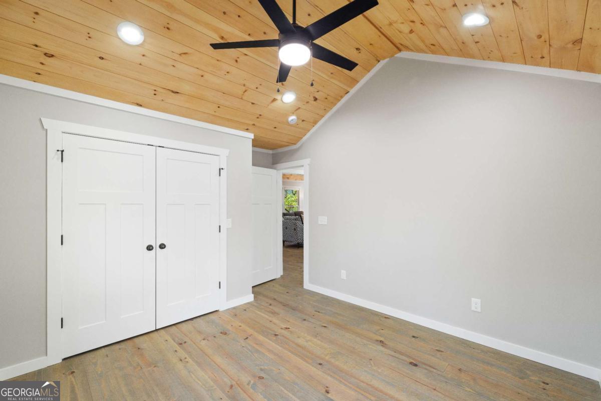 292 Wits End Way Cherry Log, GA 30522 - Photo 12 of 32 wooden floor in an empty room