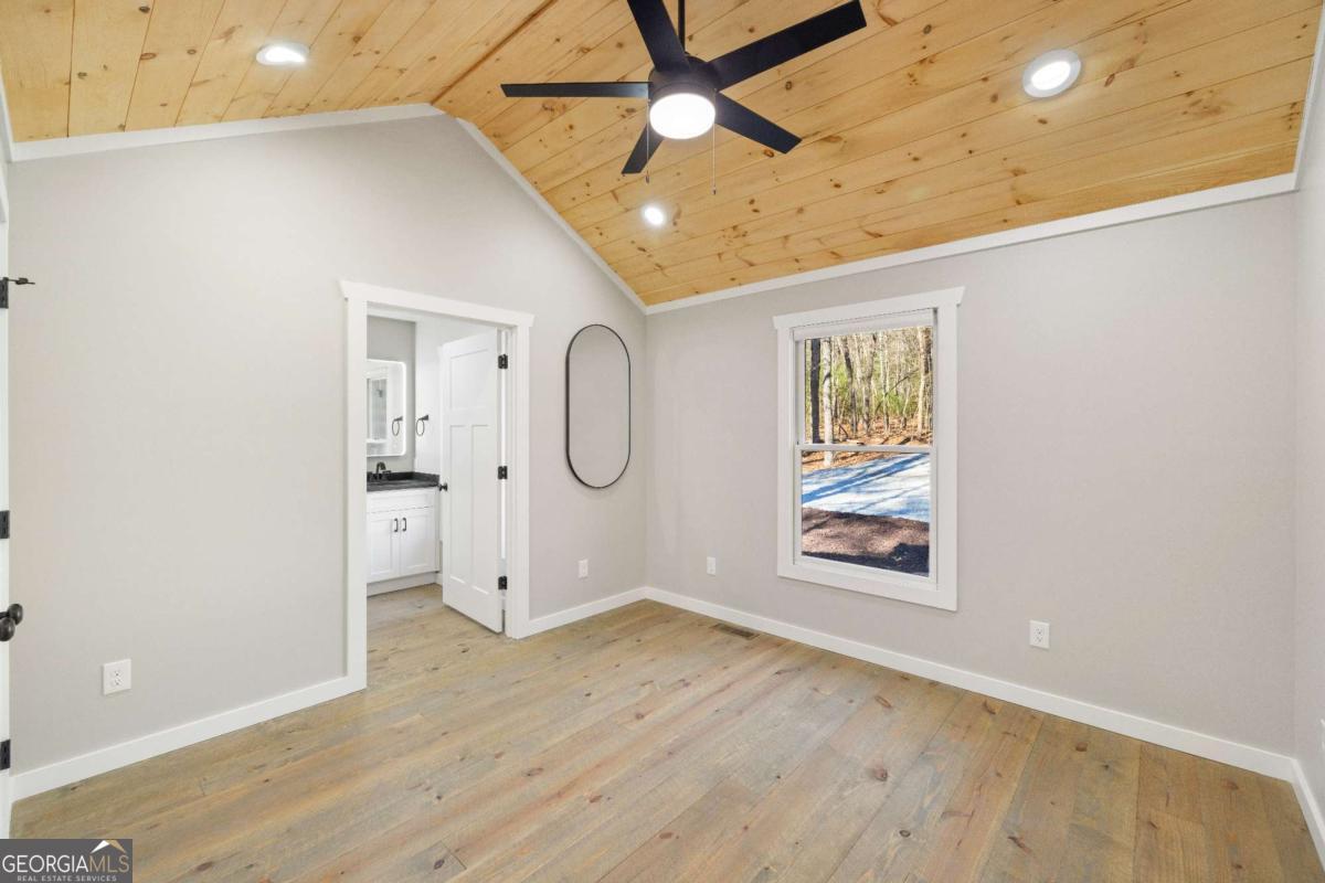 292 Wits End Way Cherry Log, GA 30522 - Photo 9 of 32 a view of empty room with wooden floor
