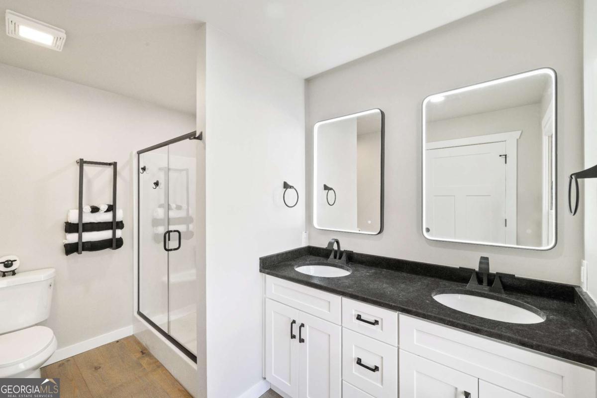 292 Wits End Way Cherry Log, GA 30522 - Photo 10 of 32 a bathroom with a granite countertop sink mirror and double