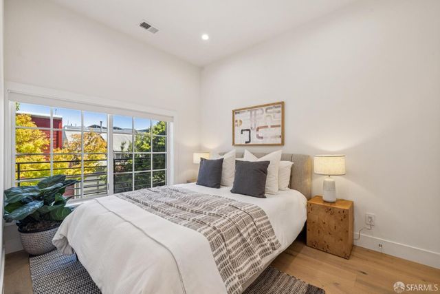 a bedroom with a bed and a table