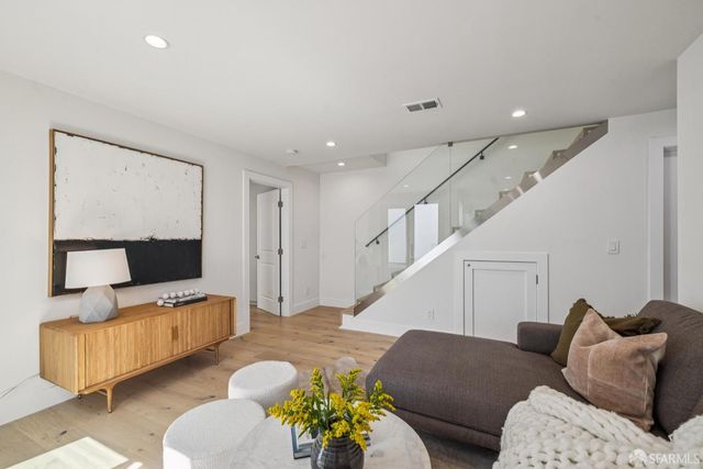 a bathroom with a double vanity sink a mirror and shower