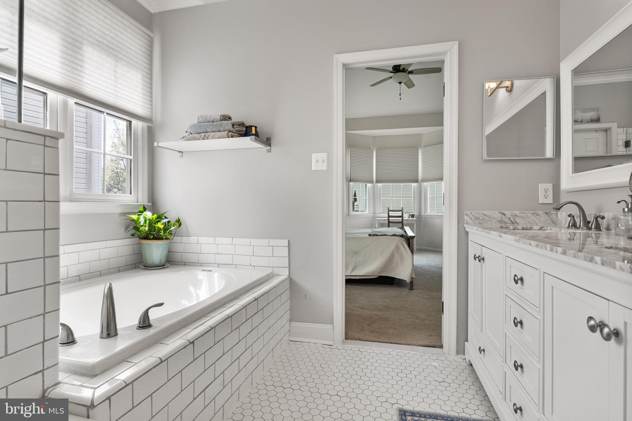 6 Augusta Drive Westampton, NJ 08060 - Photo 18 of 31 a bathroom with a granite countertop tub a double vanity sink and a mirror