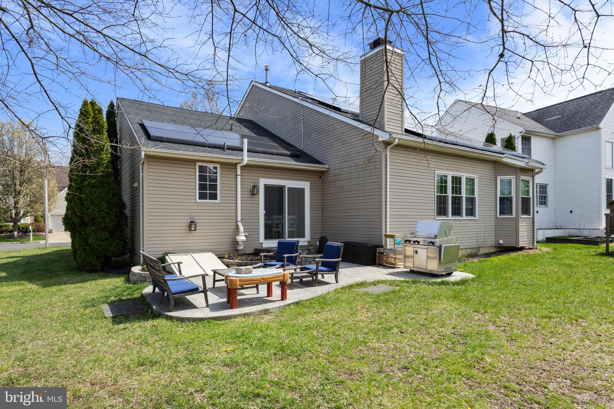 6 Augusta Drive Westampton, NJ 08060 - Photo 31 of 31 a backyard of a house with fire pit and chairs