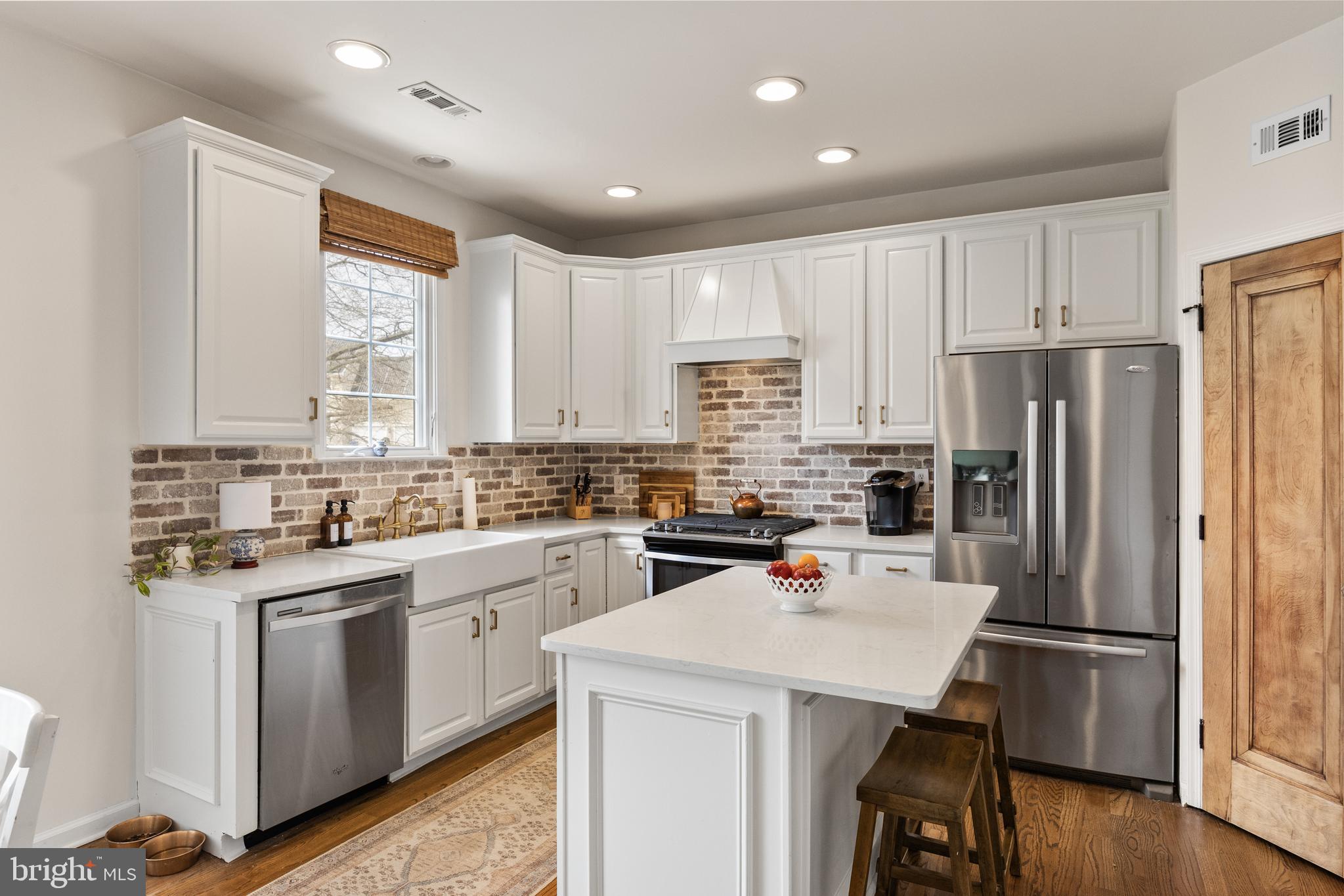 6 Augusta Drive Westampton, NJ 08060 - Photo 8 of 31 a kitchen with a refrigerator a sink dishwasher a stove and white cabinets with wooden floor
